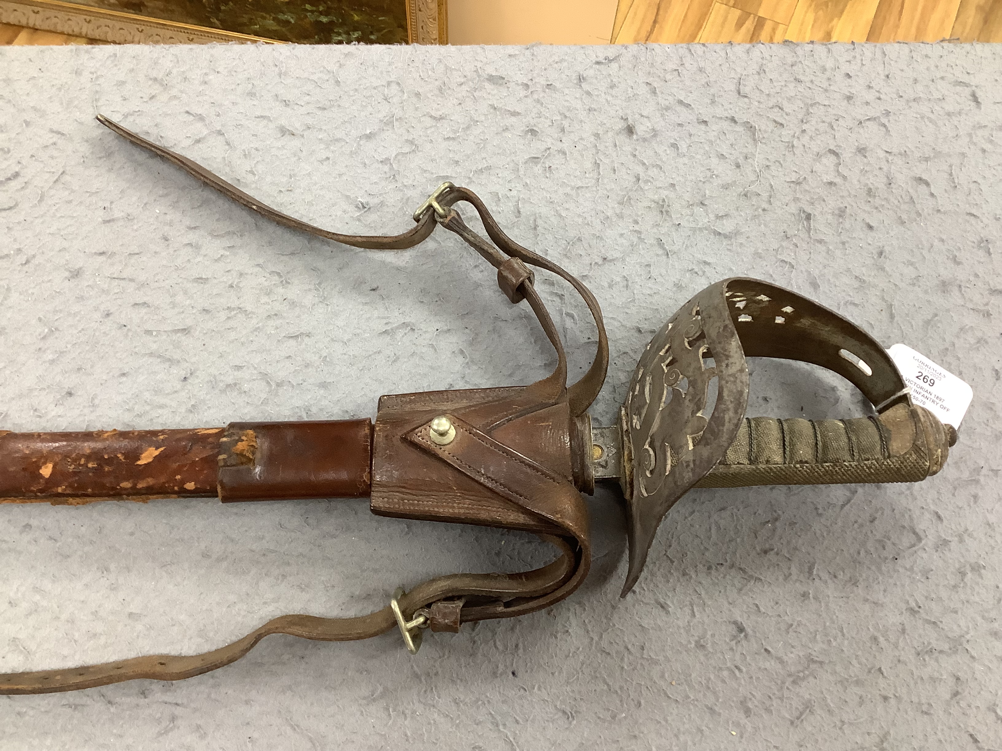 A Victorian 1897 pattern infantry officer's sword, maker Robert Mole & Sons, Birmingham, marked War and India offices, with scabbard and leather hanger, blade 82cm